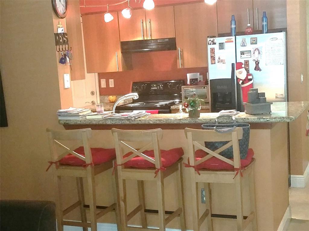 5880 West Sample Road, Unit 105 Coral Springs, FL 33067 - Photo 4 of 23 a dining room with furniture and window