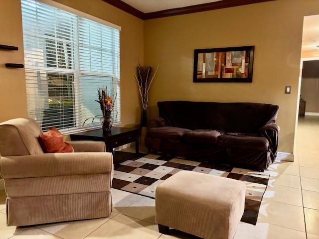 5880 West Sample Road, Unit 105 Coral Springs, FL 33067 - Photo 7 of 23 a living room with furniture and a window
