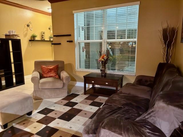 5880 West Sample Road, Unit 105 Coral Springs, FL 33067 - Photo 9 of 23 a living room with furniture and a window
