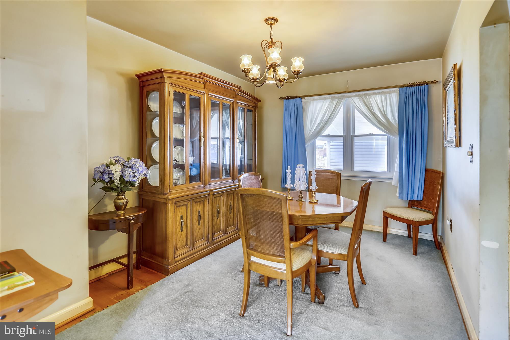 1917 Ormand Road Dundalk, MD 21222 - Photo 12 of 22 a dining room with furniture a chandelier and window