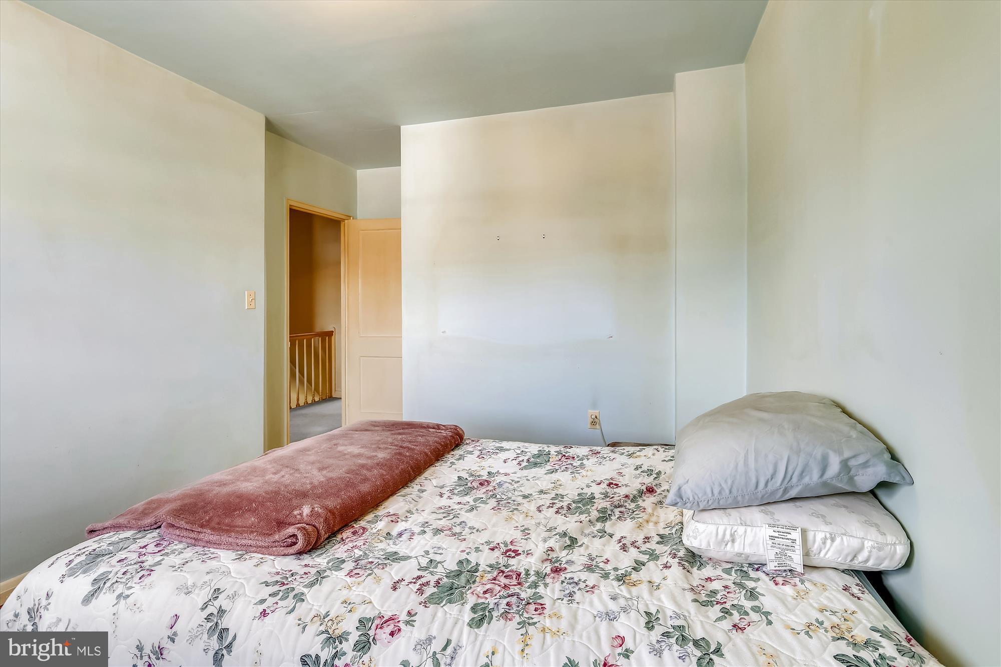 1917 Ormand Road Dundalk, MD 21222 - Photo 16 of 22 a bedroom with a bed and a mirror