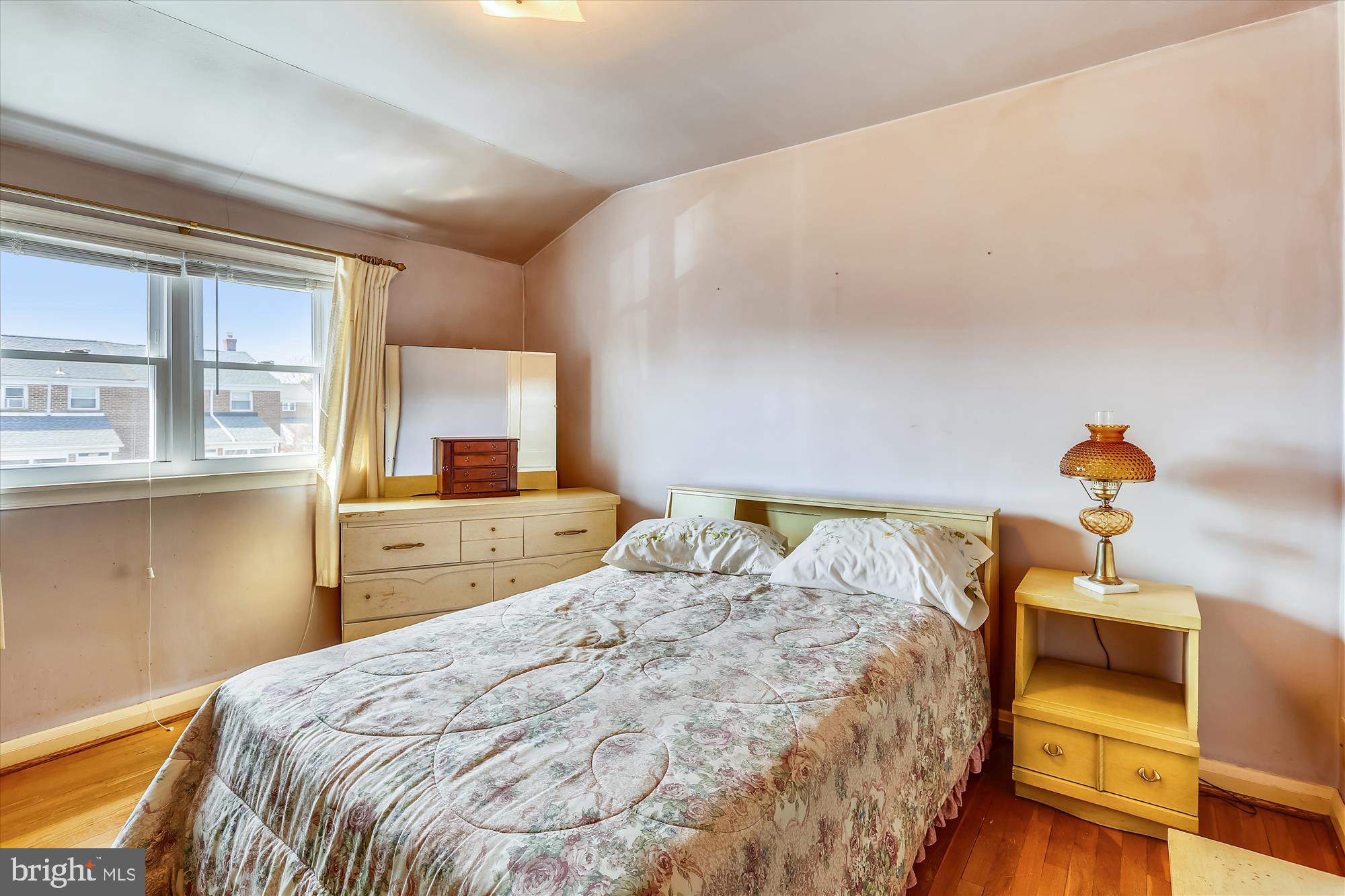 1917 Ormand Road Dundalk, MD 21222 - Photo 19 of 22 a bedroom with a bed and wooden floor
