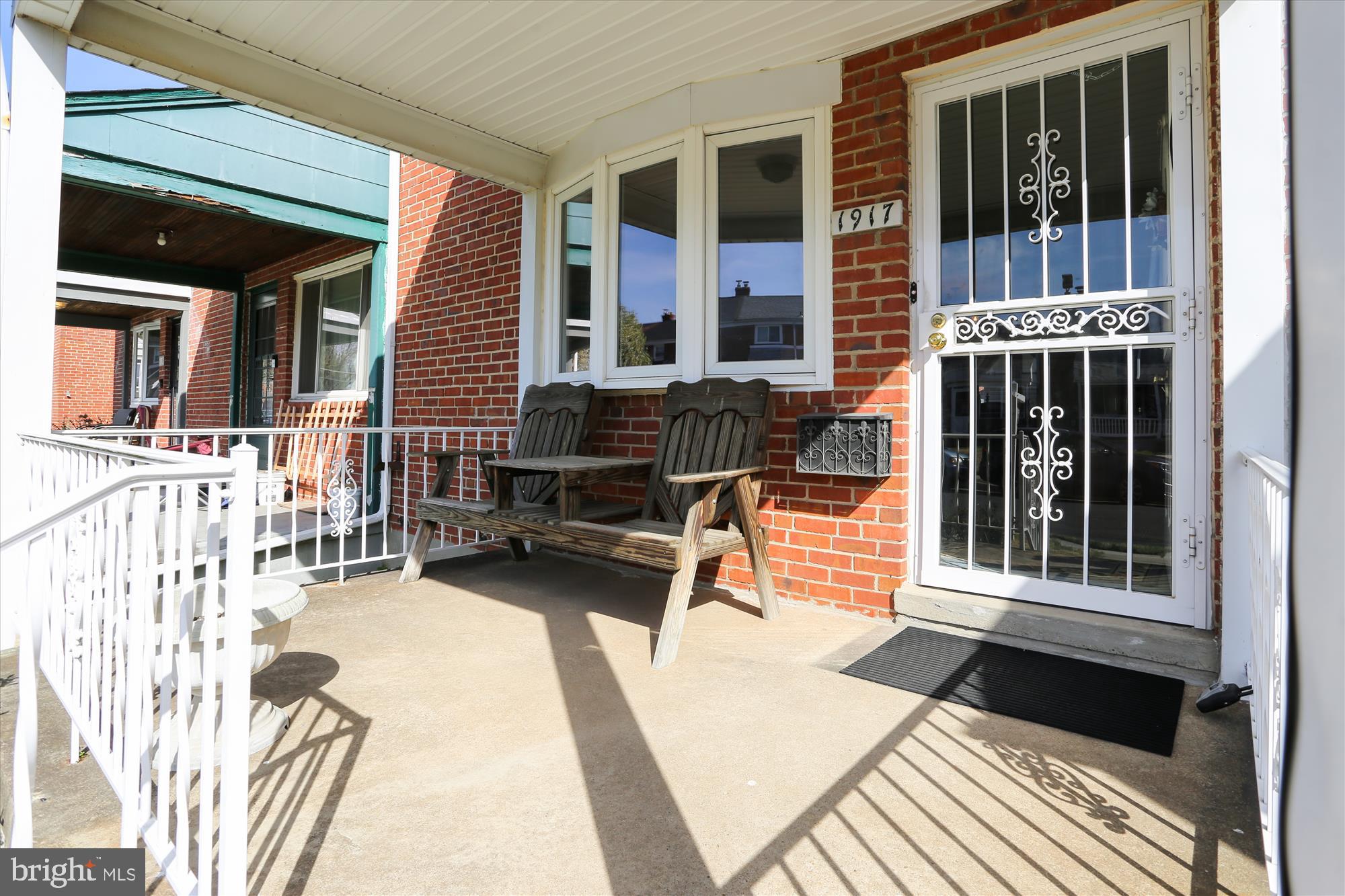 1917 Ormand Road Dundalk, MD 21222 - Photo 2 of 22 front view of a house with a bench