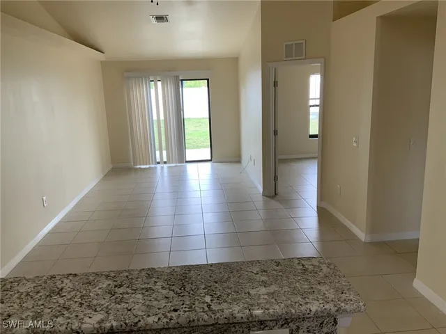 an empty room with closet area