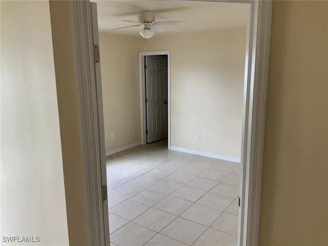 a bathroom with a toilet and a shower curtain