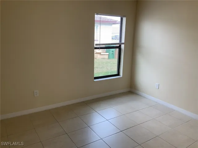 a white toilet and tub sitting next to a bathroom sink