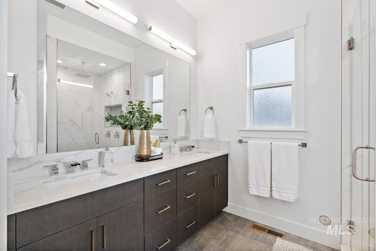 599 West Warren Street Boise, ID 83706 - Photo 23 of 41 Dual vanity featuring undermount sinks, chrome fixtures, and a white quartz countertop