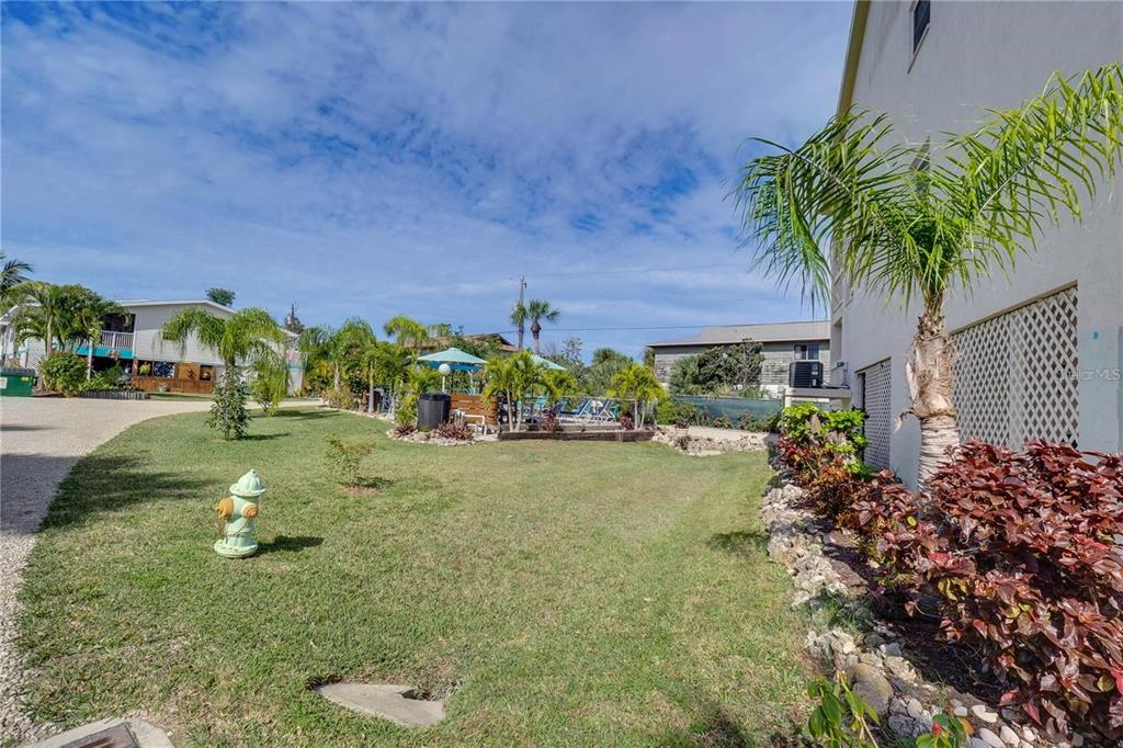 5031 North Beach Road, Unit 116 Englewood, FL 34223 - Photo 27 of 41 a view of a garden