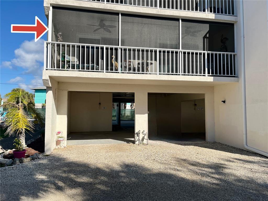 5031 North Beach Road, Unit 116 Englewood, FL 34223 - Photo 4 of 41 a view of a house with a porch