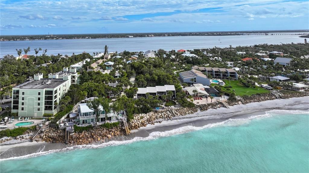5031 North Beach Road, Unit 116 Englewood, FL 34223 - Photo 9 of 41 an aerial view of a house with a yard and lake view