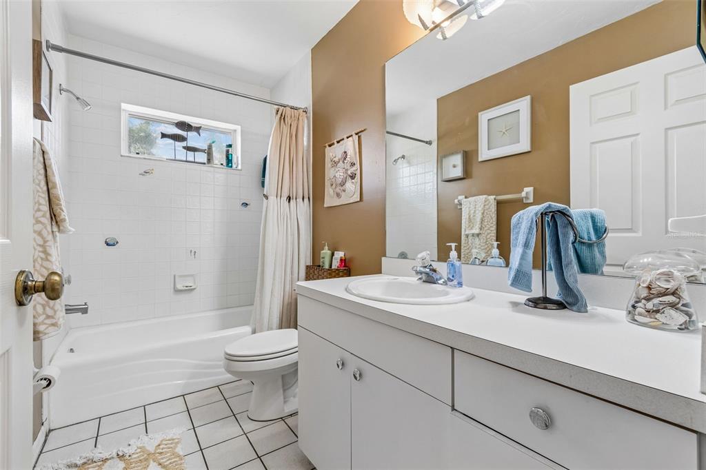 119 Burns Road Terra Ceia, FL 34250 - Photo 54 of 100 a bathroom with a sink a toilet and shower
