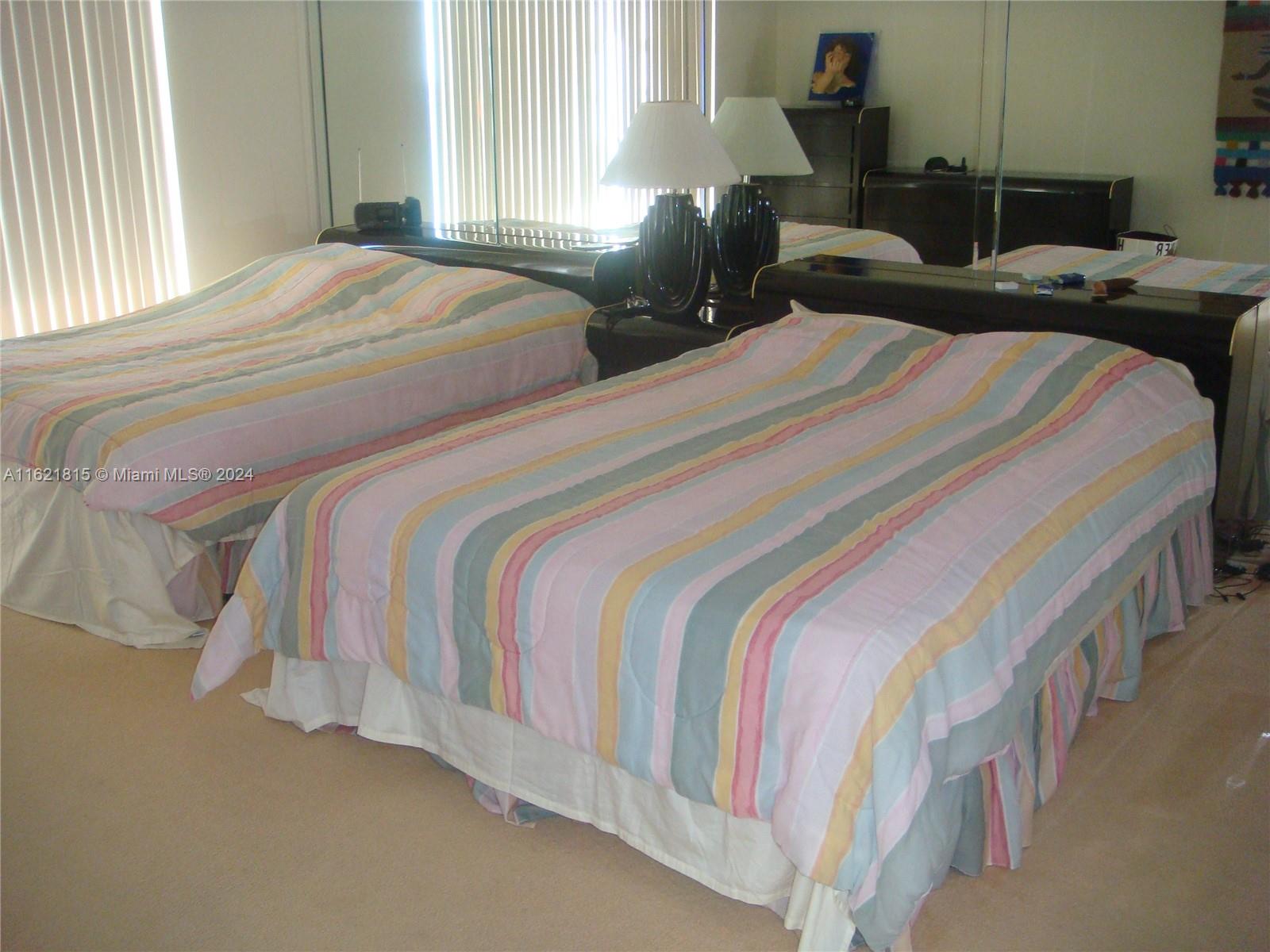 5401 Collins Avenue, Unit 1012 Miami Beach, FL 33140 - Photo 11 of 11 a bedroom with two beds and large window