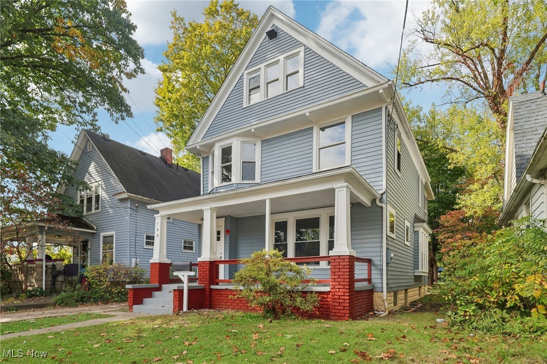 748 Chalker Street Akron, OH 44310 - Photo 5 of 48 American foursquare style home featuring a front lawn and a porch