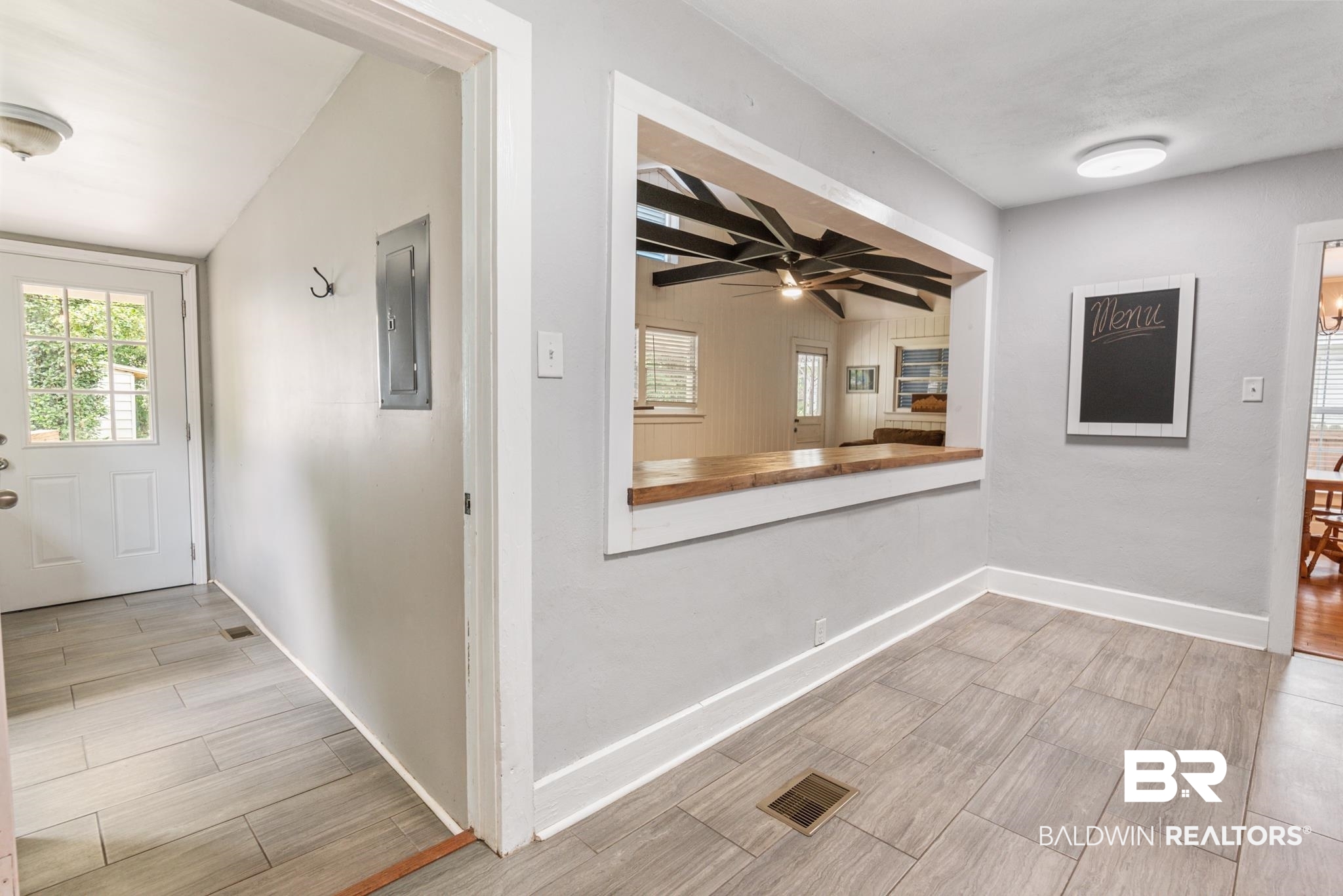 114 Crenshaw Street Mobile, AL 36606 - Photo 24 of 49 Hallway with light hardwood / wood-style floors, electric panel, and vaulted ceiling with beams