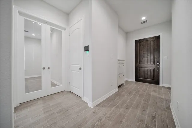 a view of entryway with wooden floor