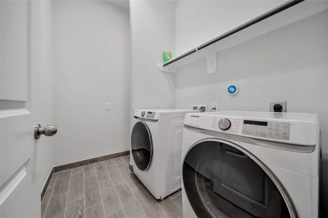a bathroom with a sink mirror and toilet