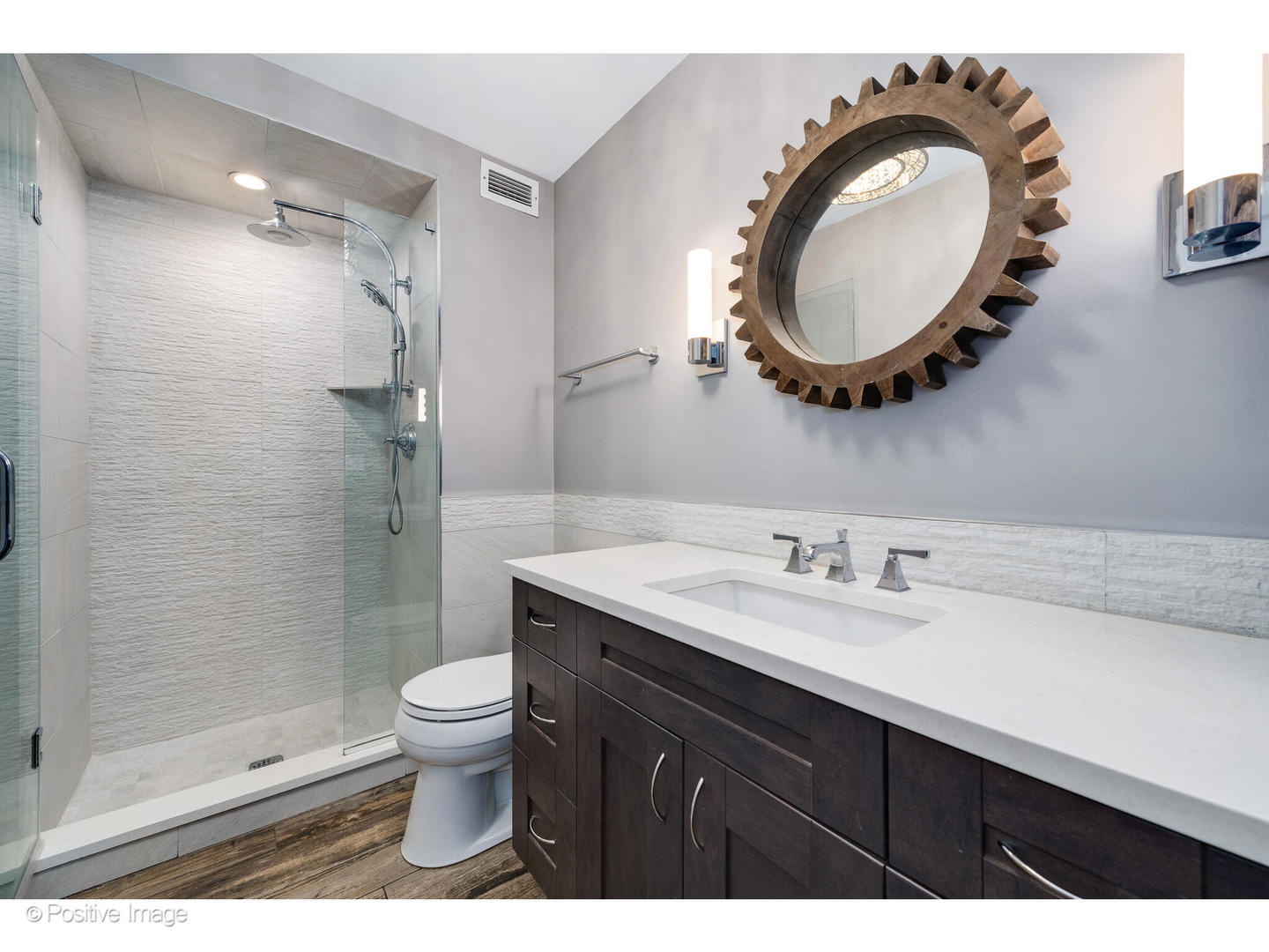 6007 North Sheridan Road, Unit 8B Chicago, IL 60660 - Photo 16 of 23 a bathroom with a sink a toilet and a mirror