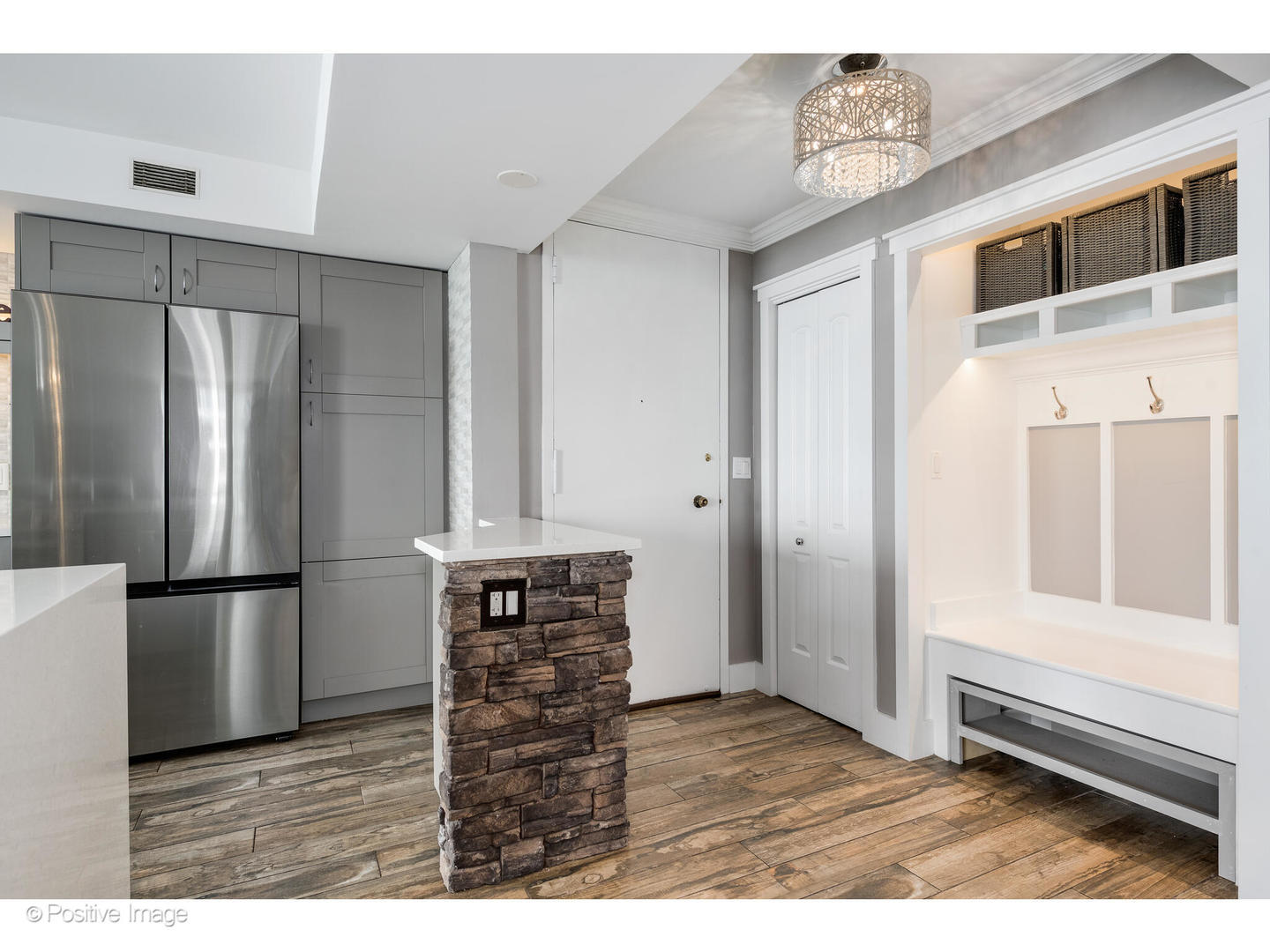 6007 North Sheridan Road, Unit 8B Chicago, IL 60660 - Photo 2 of 23 a kitchen with stainless steel appliances a refrigerator and a stove top oven