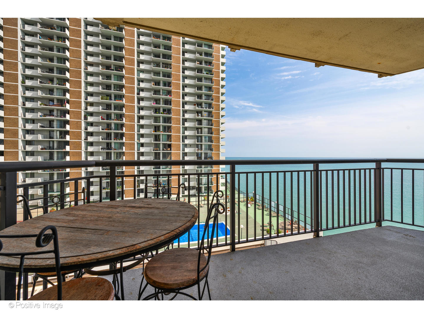 6007 North Sheridan Road, Unit 8B Chicago, IL 60660 - Photo 21 of 23 a view of balcony with a table and chairs