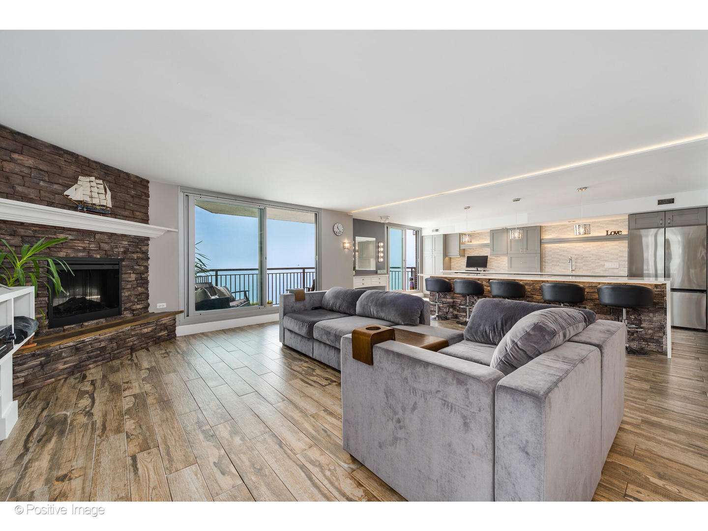 6007 North Sheridan Road, Unit 8B Chicago, IL 60660 - Photo 5 of 23 a living room with furniture and a fireplace