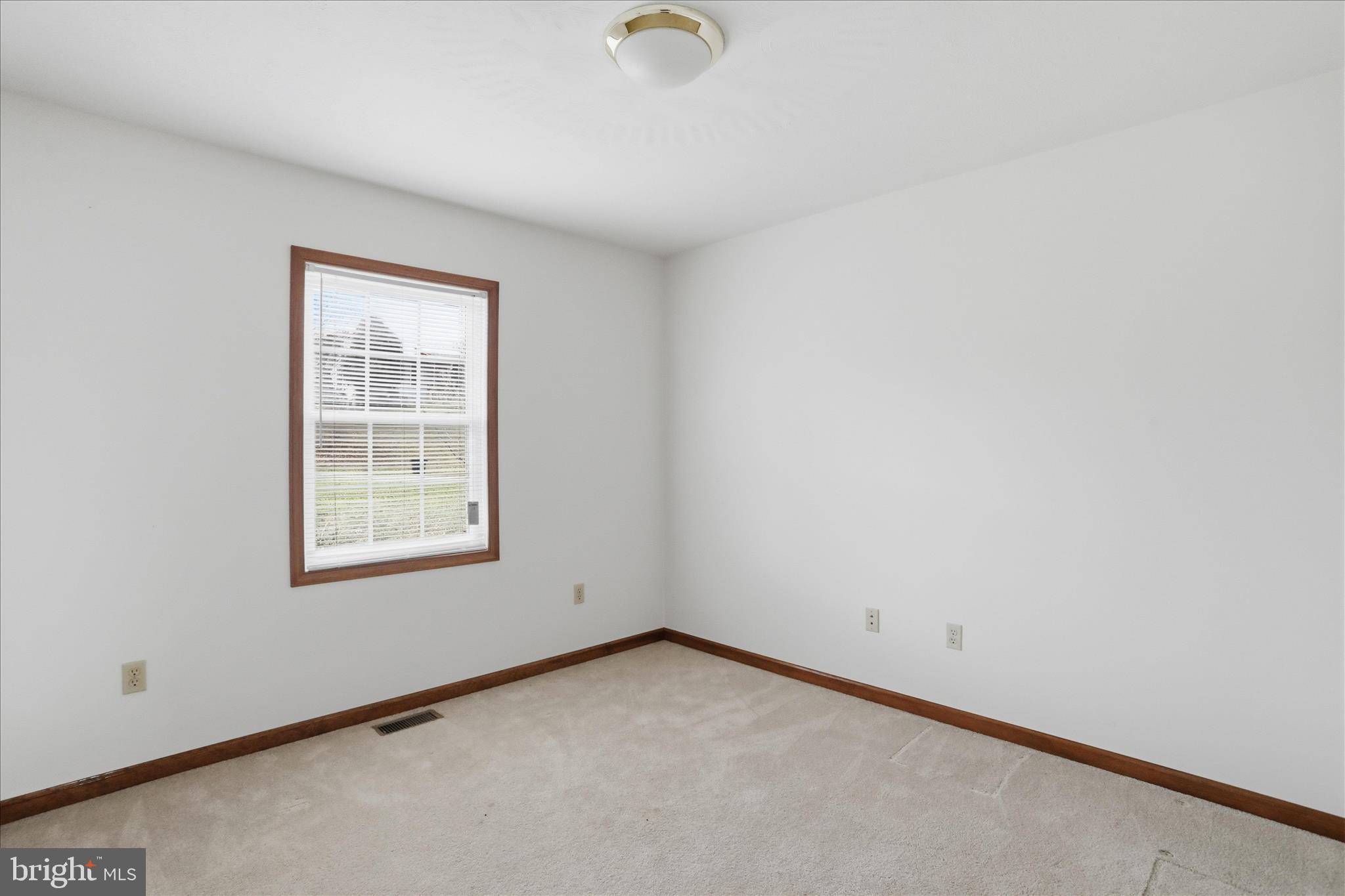 316 East Ridge Loop Road Romney, WV 26757 - Photo 19 of 33 an empty room with a window