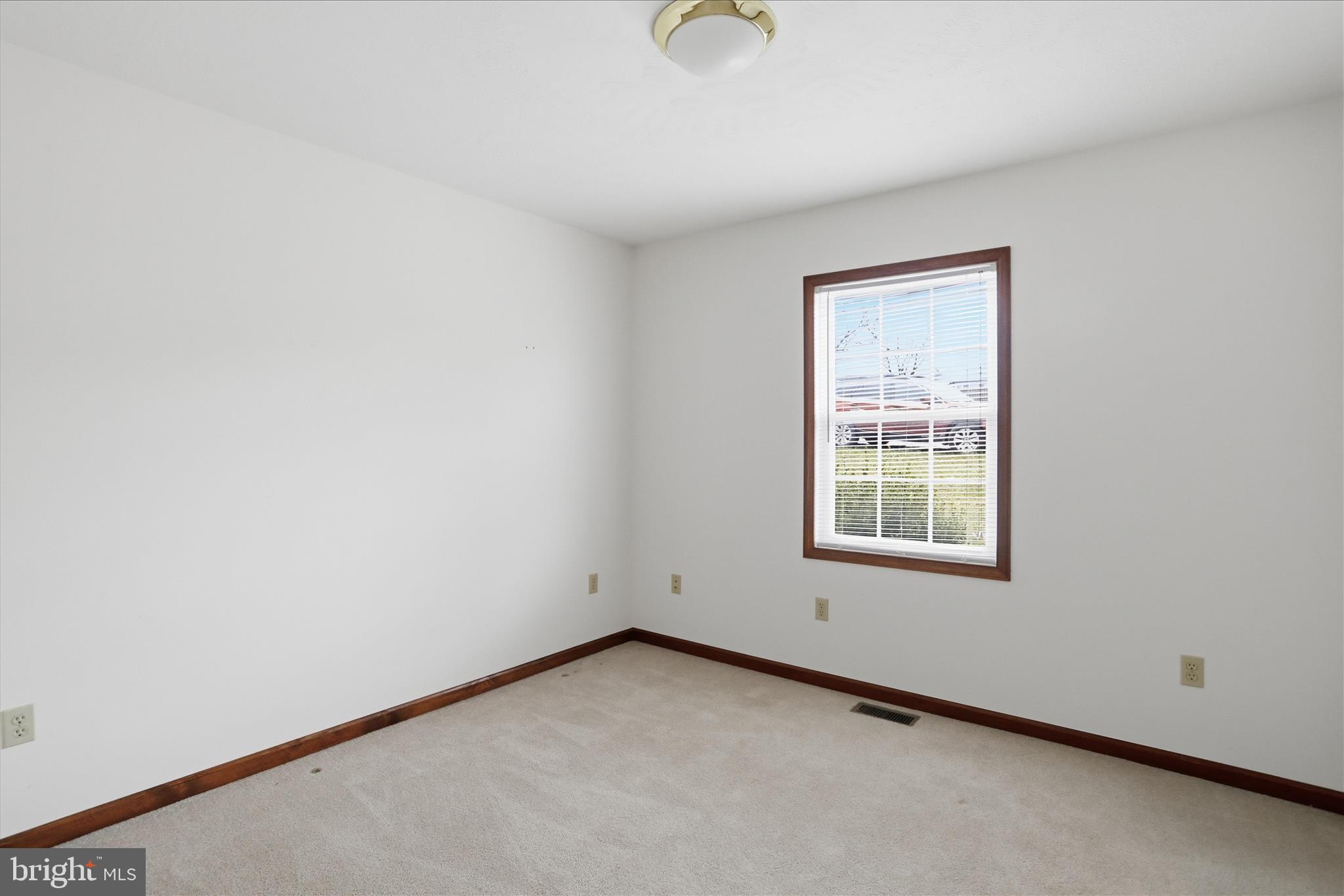 316 East Ridge Loop Road Romney, WV 26757 - Photo 21 of 33 an empty room with a window