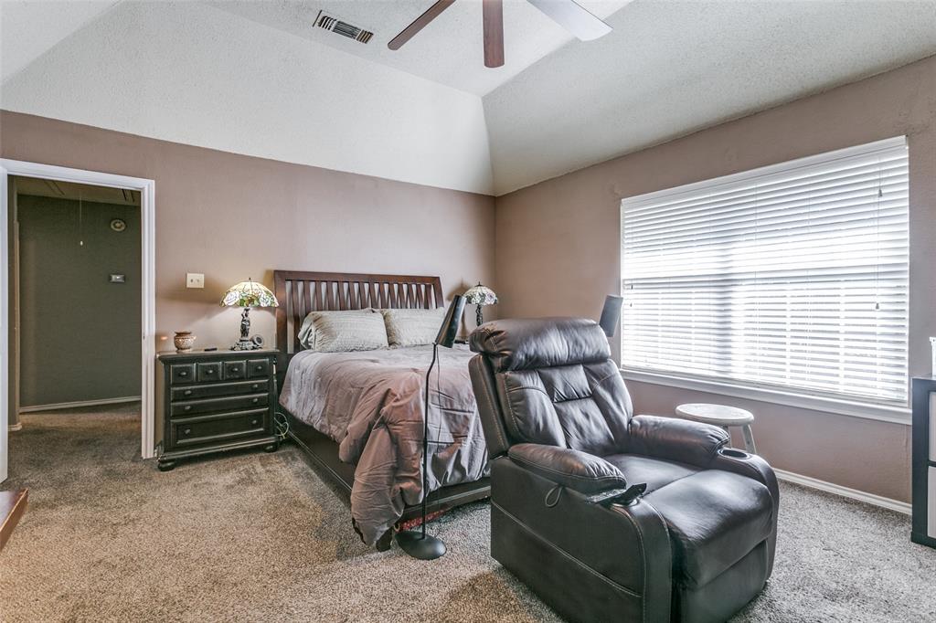 2133 Rim Rock Drive Keller, TX 76248 - Photo 24 of 37 Bedroom with lofted ceiling, carpet flooring, ceiling fan, and a textured ceiling