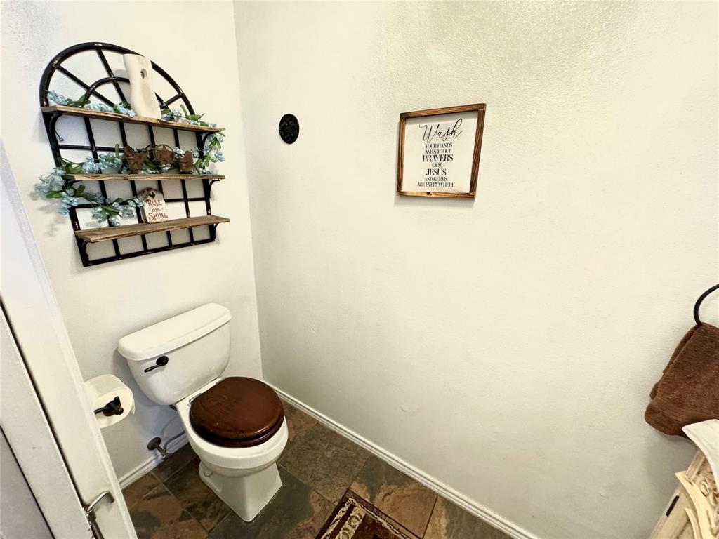 505 3rd Street Dodd City, TX 75438 - Photo 24 of 37 a bathroom with a toilet and a sink