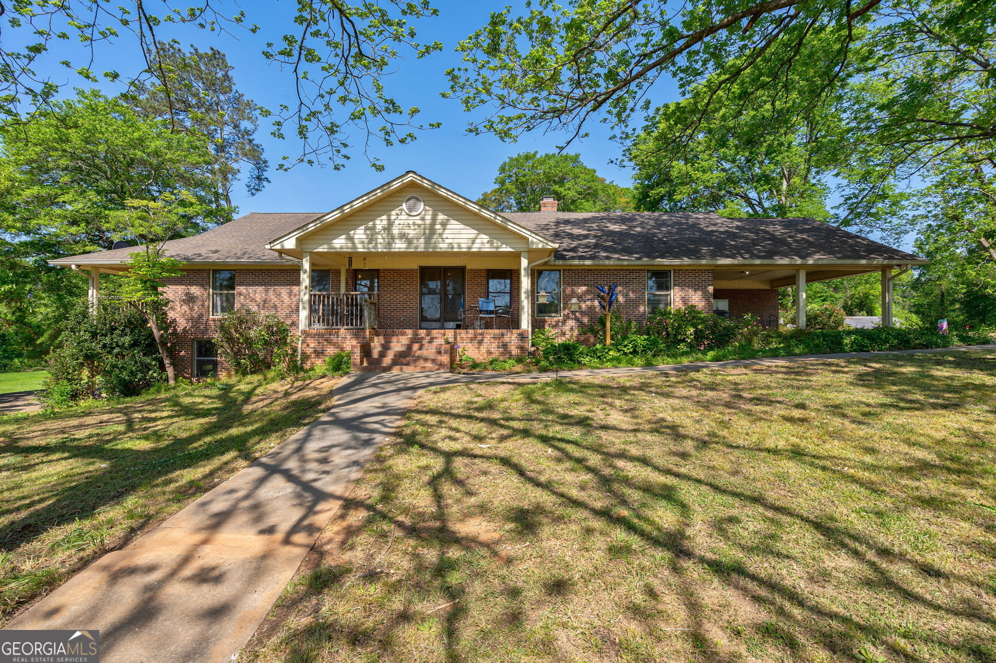 1281 Apalachee River Road Madison, GA 30650 - Photo 53 of 98 a front view of a house with a yard