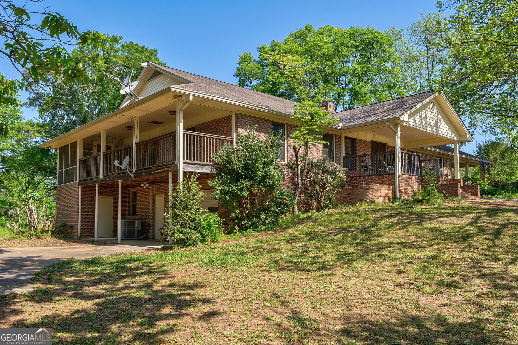 1281 Apalachee River Road Madison, GA 30650 - Photo 57 of 98 a front view of a house with a garden