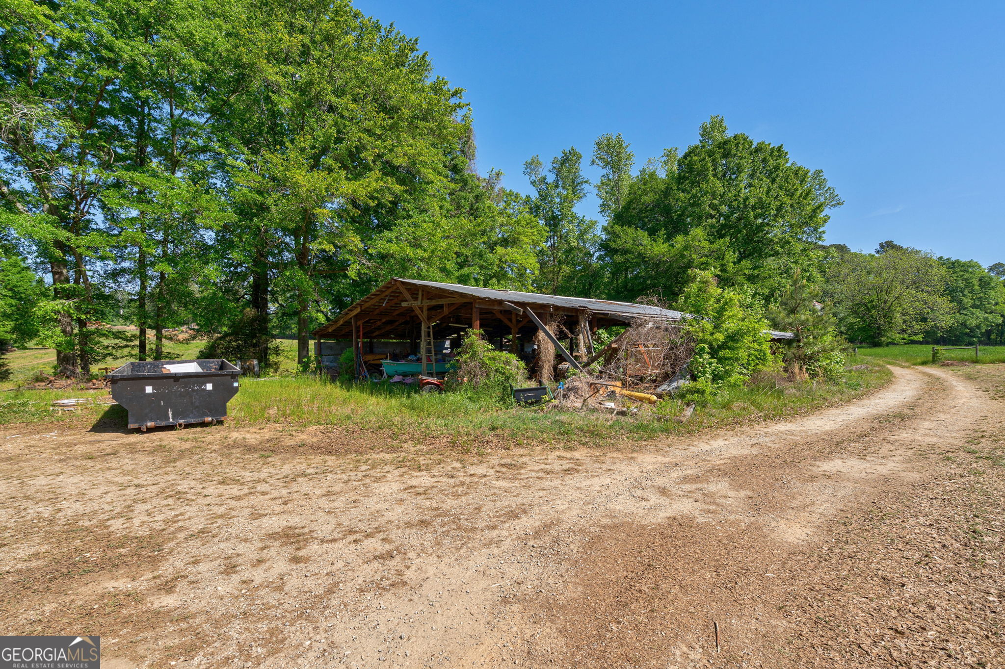 1281 Apalachee River Road Madison, GA 30650 - Photo 65 of 98 a view of a house with yard and sitting area