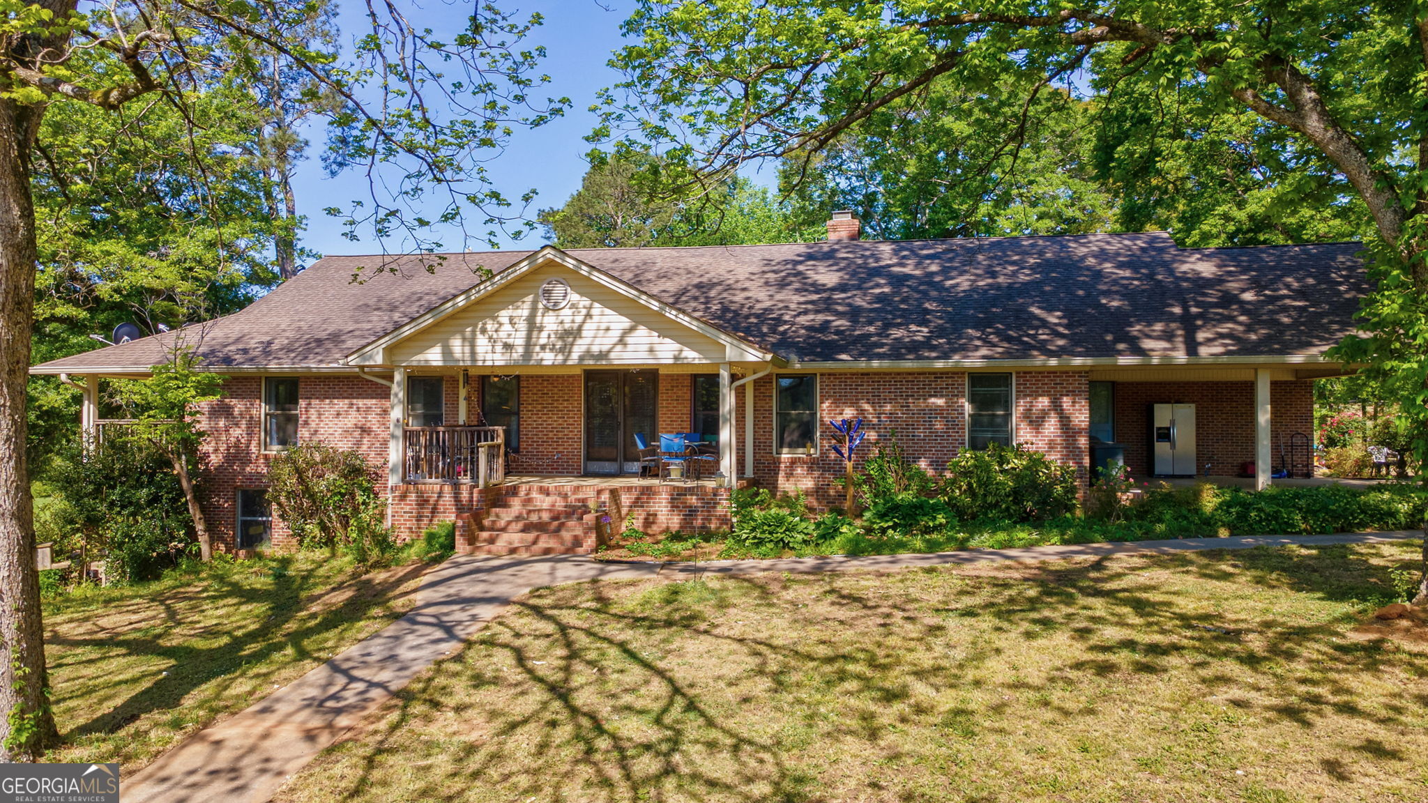 1281 Apalachee River Road Madison, GA 30650 - Photo 73 of 98 a front view of a house with garden