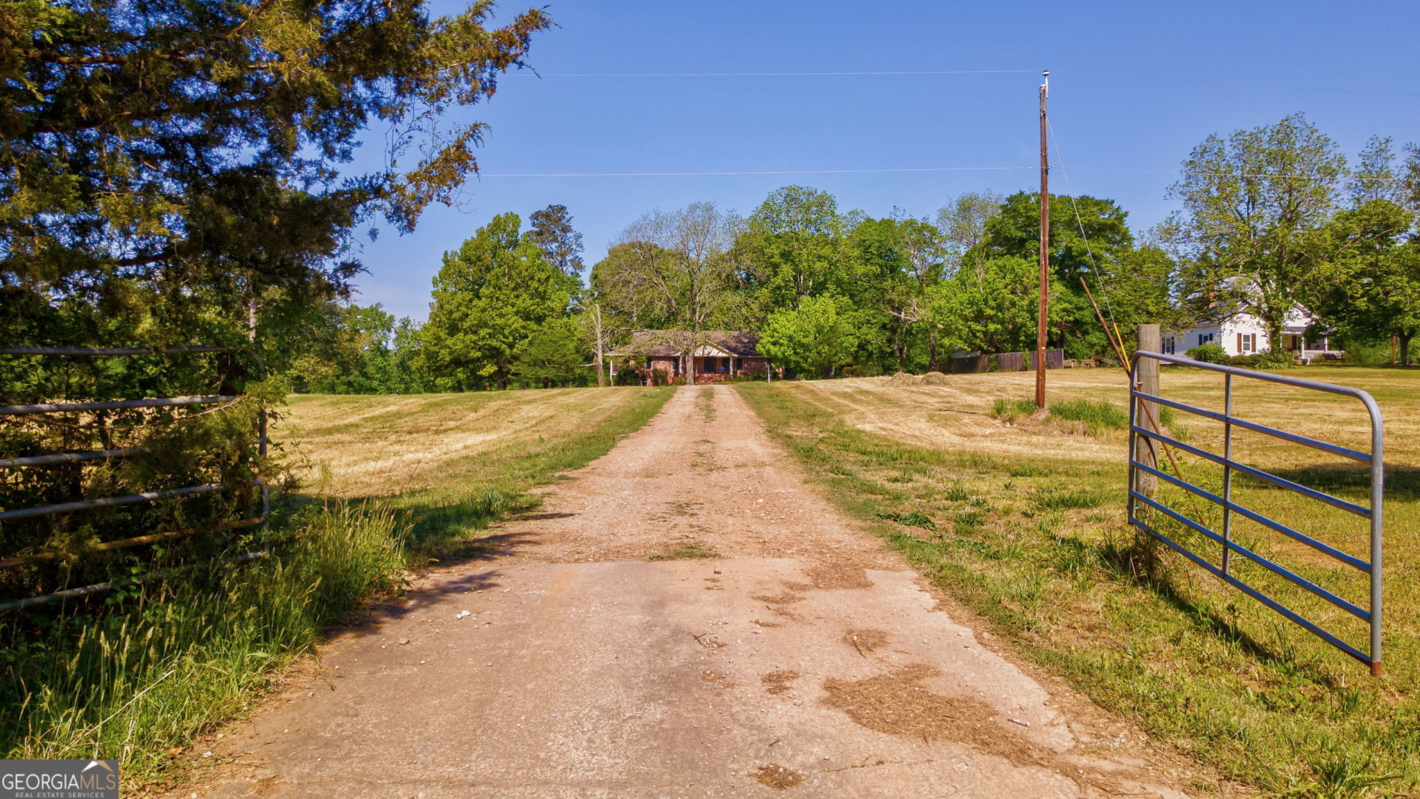 1281 Apalachee River Road Madison, GA 30650 - Photo 84 of 98 a view of a yard with wooden fence