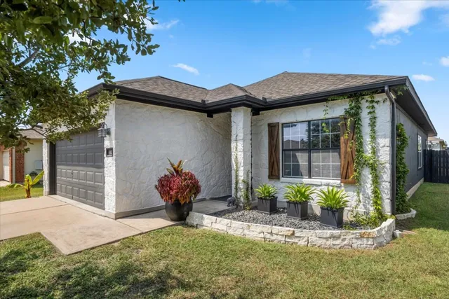 a front view of a house with a yard