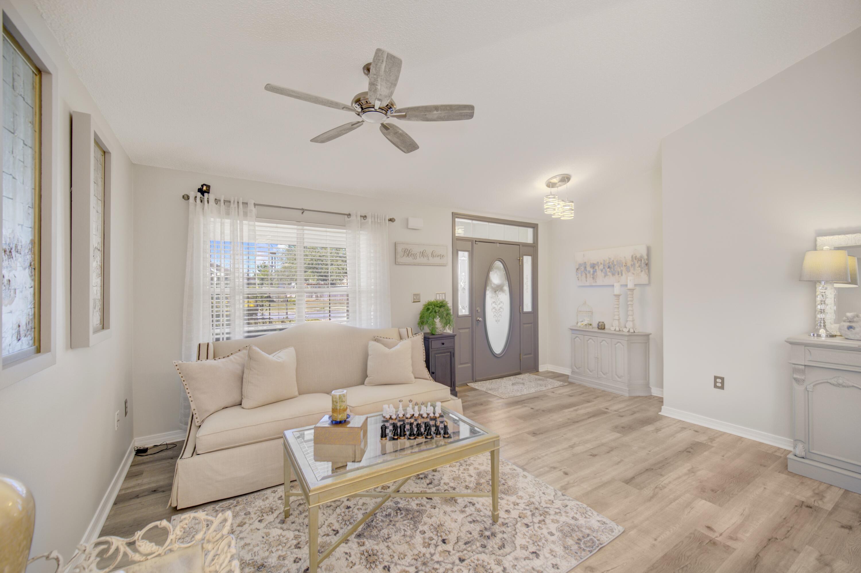 35 Red Bay Court Santa Rosa Beach, FL 32459 - Photo 17 of 73 a living room with furniture and a rug