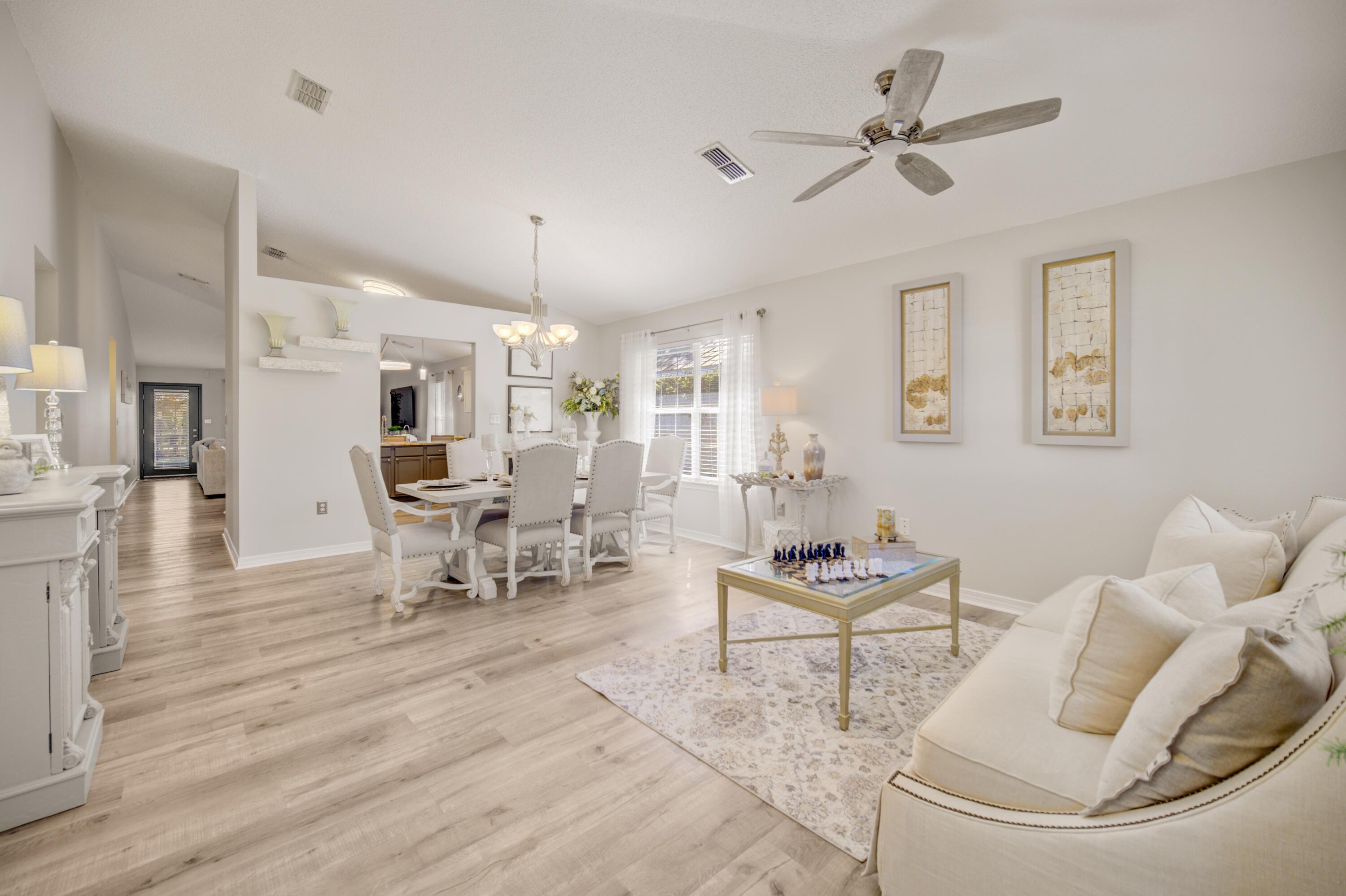 35 Red Bay Court Santa Rosa Beach, FL 32459 - Photo 21 of 73 a living room with furniture and a wooden floor