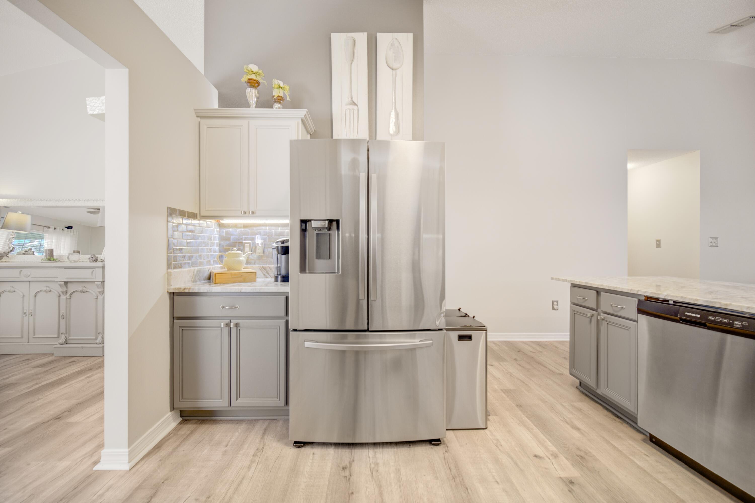 35 Red Bay Court Santa Rosa Beach, FL 32459 - Photo 26 of 73 a kitchen with cabinets and stainless steel appliances