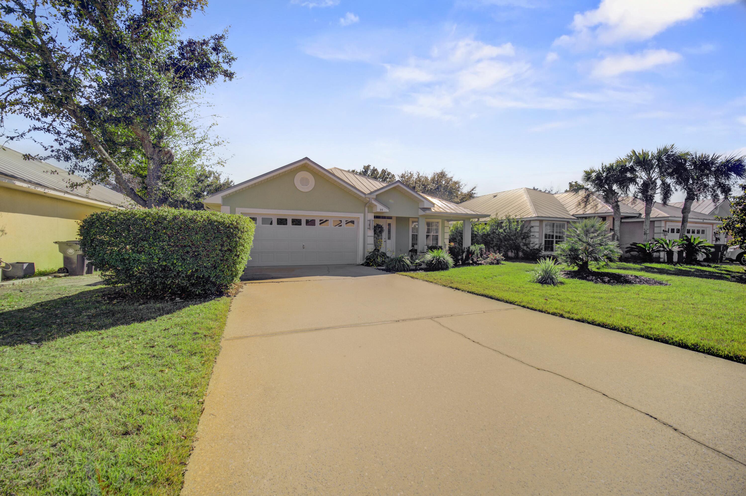35 Red Bay Court Santa Rosa Beach, FL 32459 - Photo 3 of 73 a view of house with a yard and potted plants