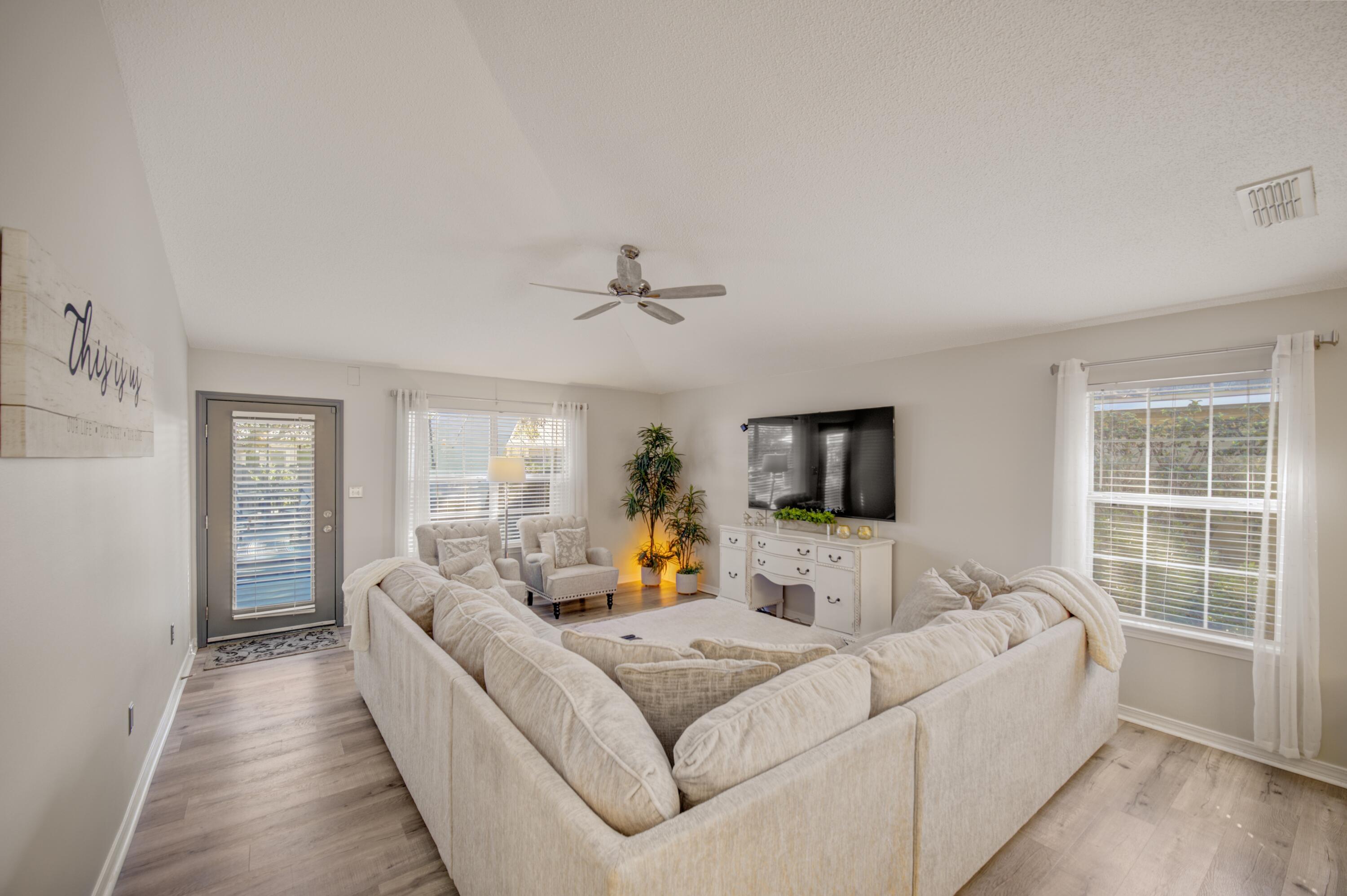 35 Red Bay Court Santa Rosa Beach, FL 32459 - Photo 33 of 73 a living room with furniture and a flat screen tv