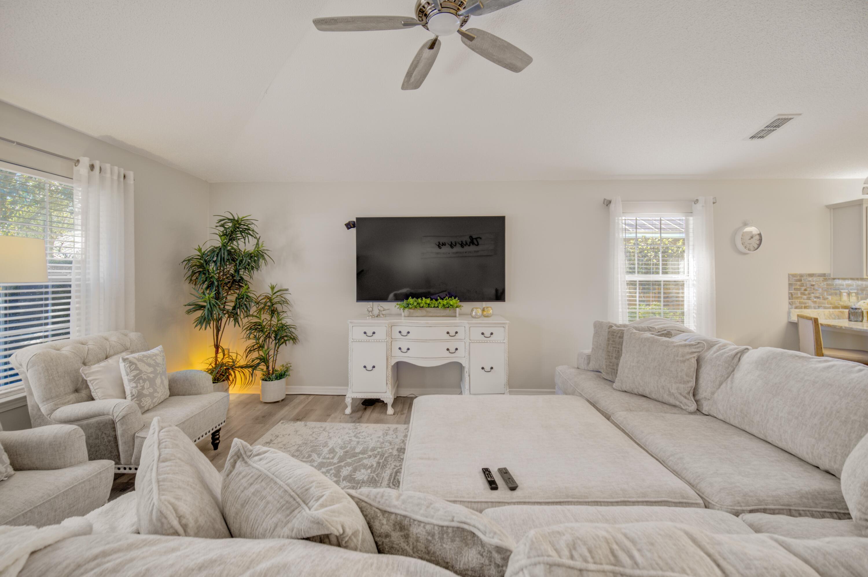 35 Red Bay Court Santa Rosa Beach, FL 32459 - Photo 35 of 73 a living room with furniture and a flat screen tv
