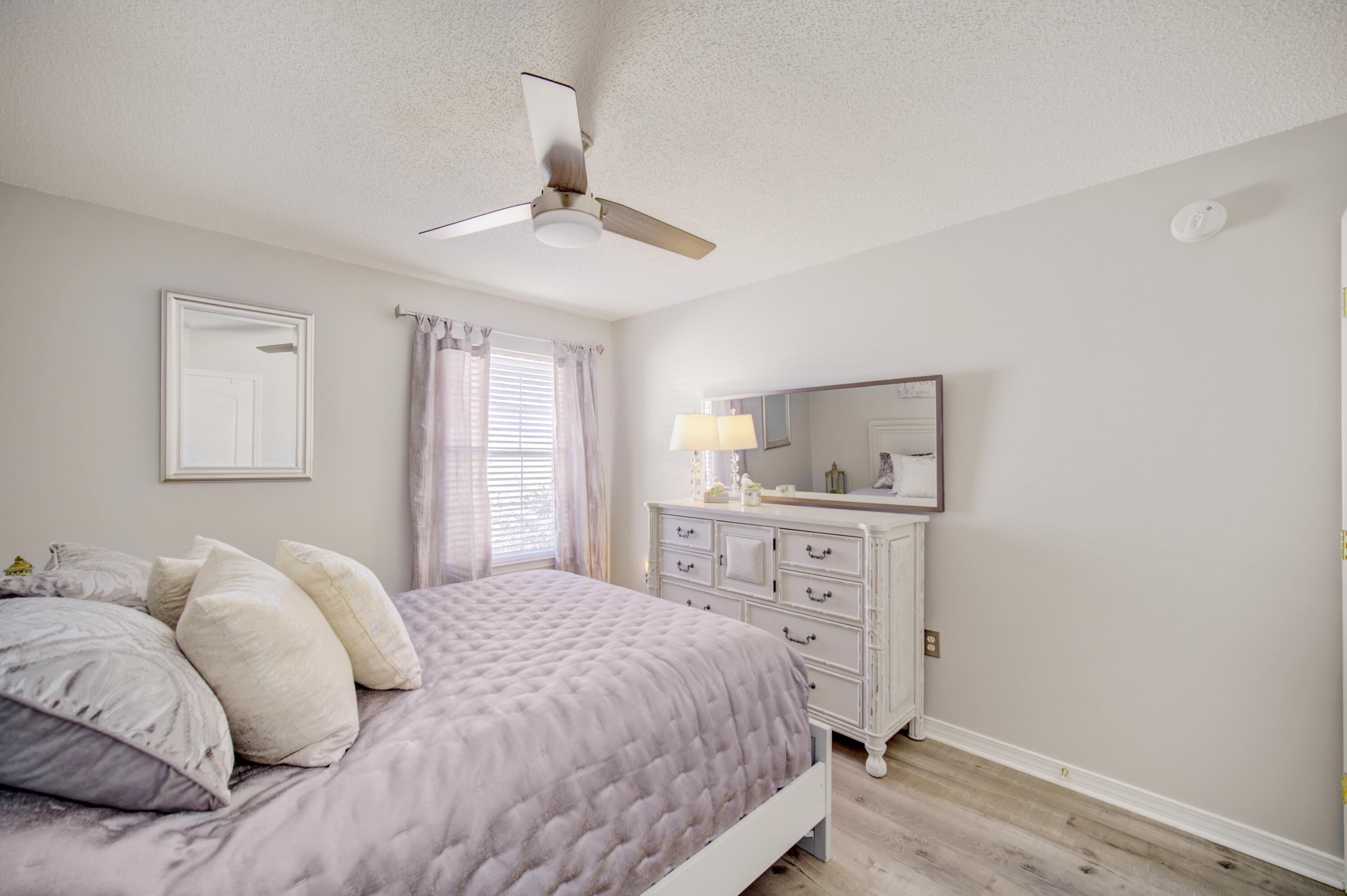 35 Red Bay Court Santa Rosa Beach, FL 32459 - Photo 45 of 73 a bedroom with a bed and a window