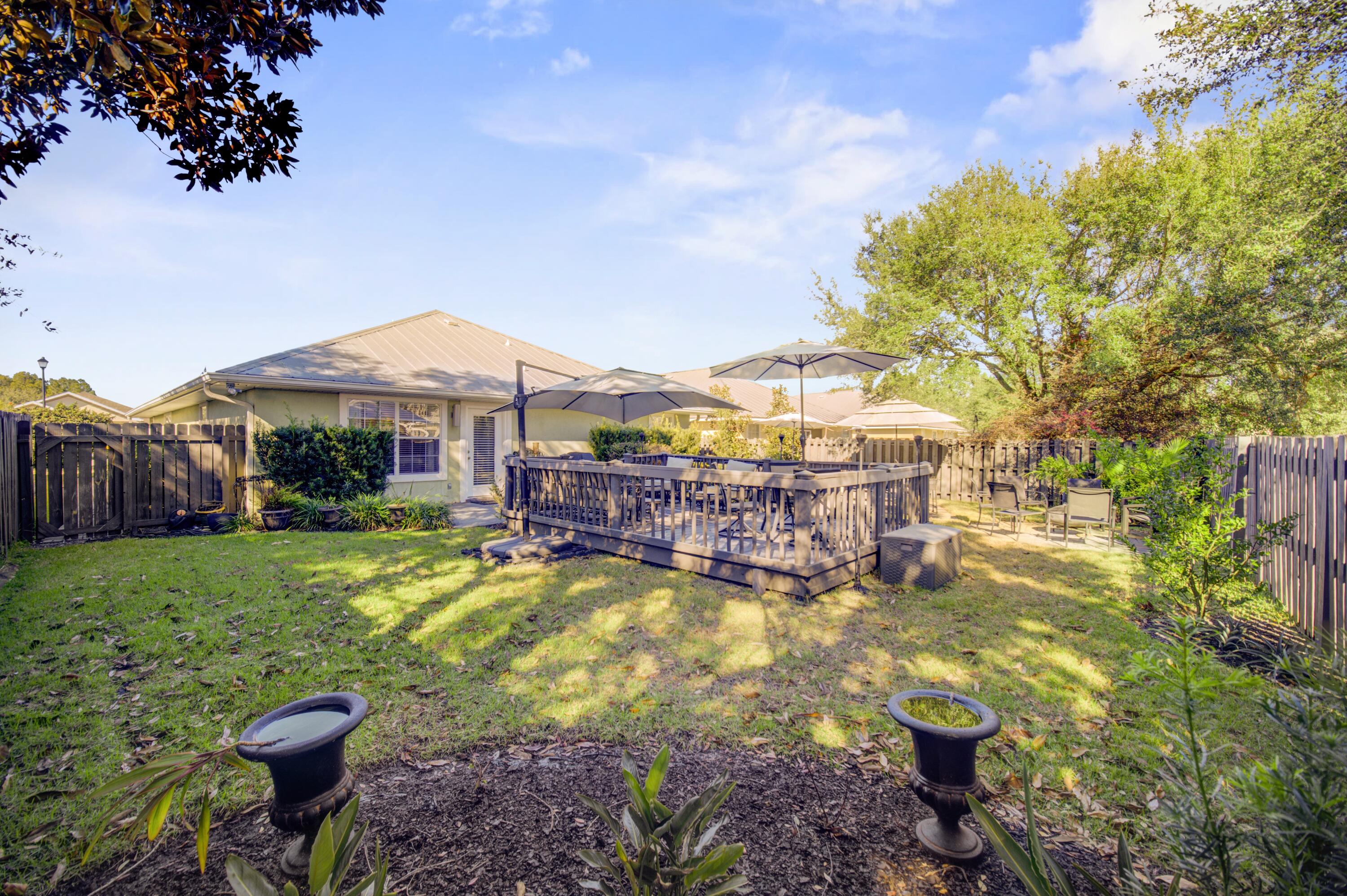 35 Red Bay Court Santa Rosa Beach, FL 32459 - Photo 60 of 73 a view of a house with backyard porch and sitting area