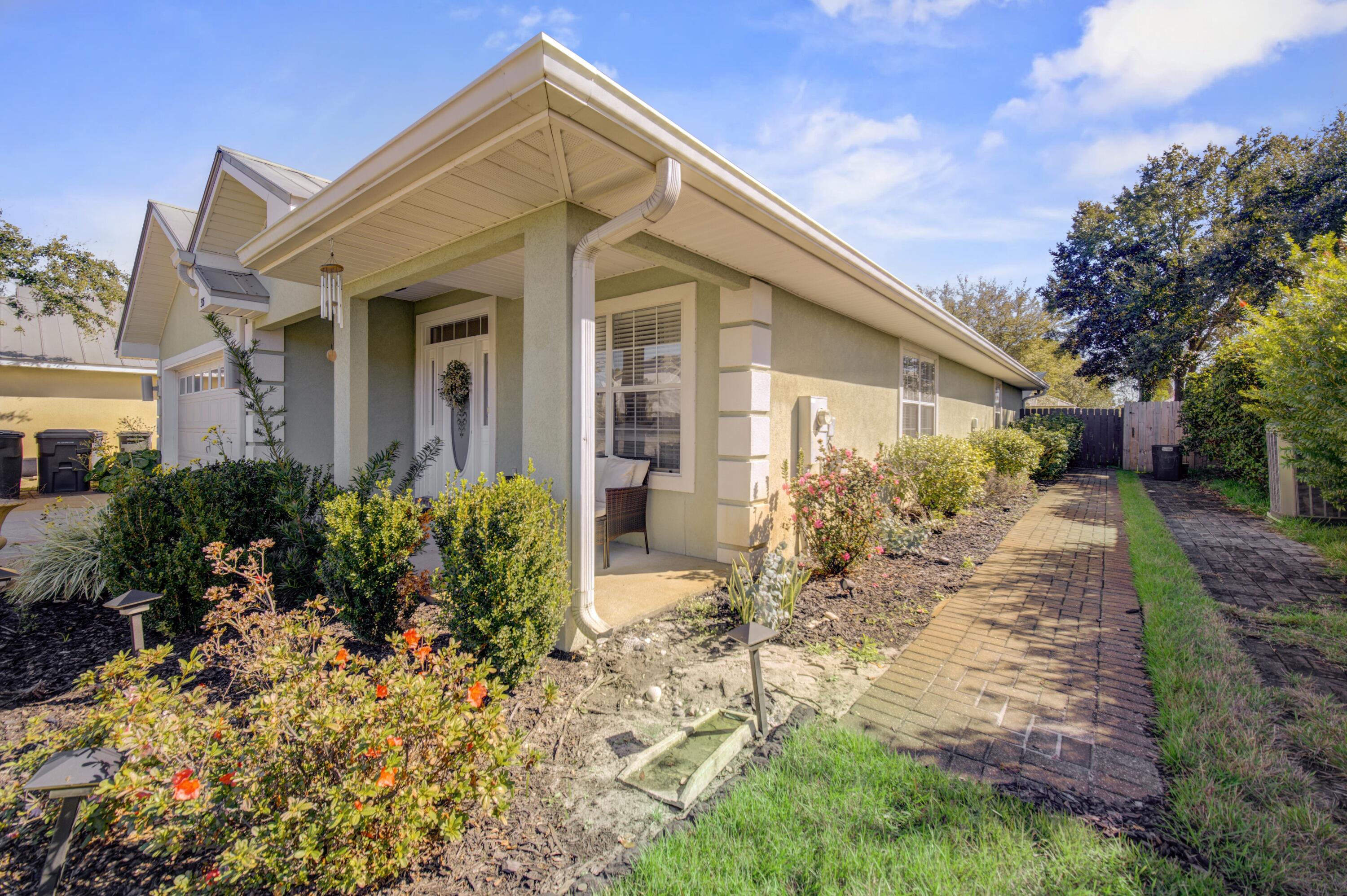 35 Red Bay Court Santa Rosa Beach, FL 32459 - Photo 6 of 73 a view of a house with a small yard and plants