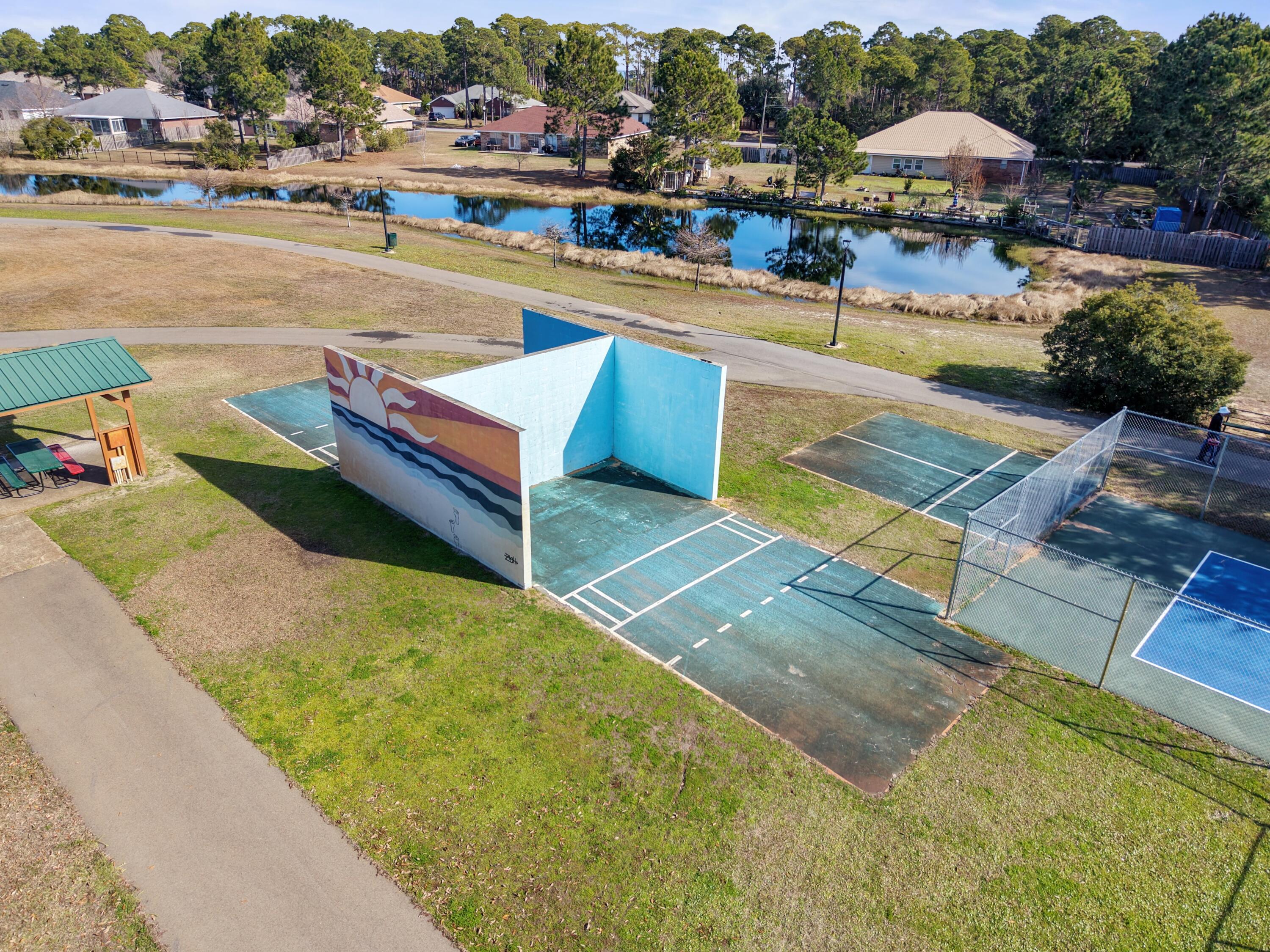 35 Red Bay Court Santa Rosa Beach, FL 32459 - Photo 69 of 73 a view of swimming pool with outdoor seating and a garden