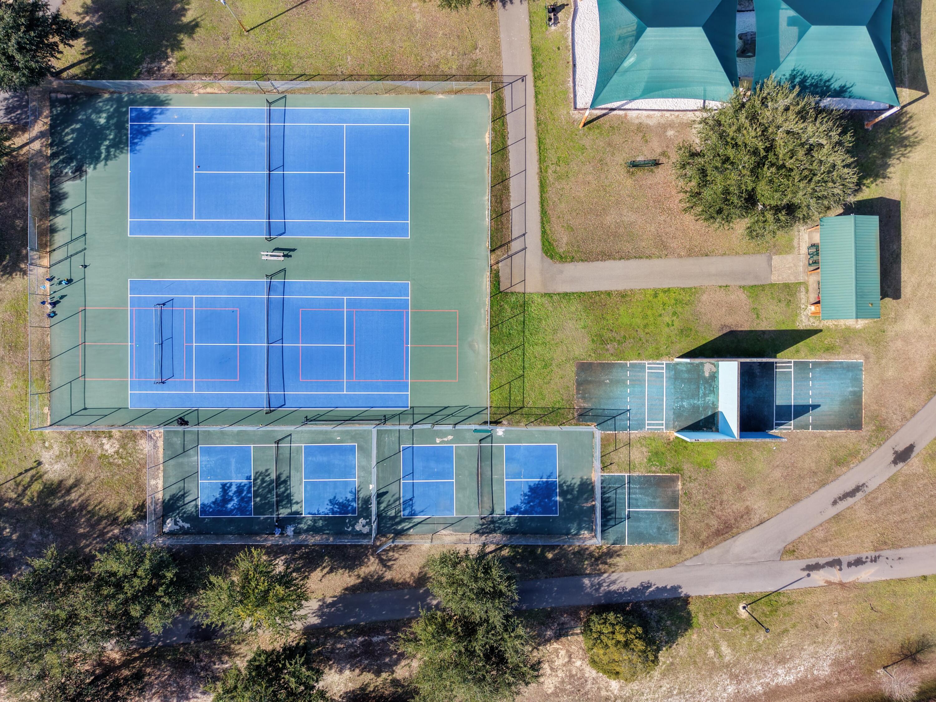 35 Red Bay Court Santa Rosa Beach, FL 32459 - Photo 71 of 73 a front view of a house with a garden