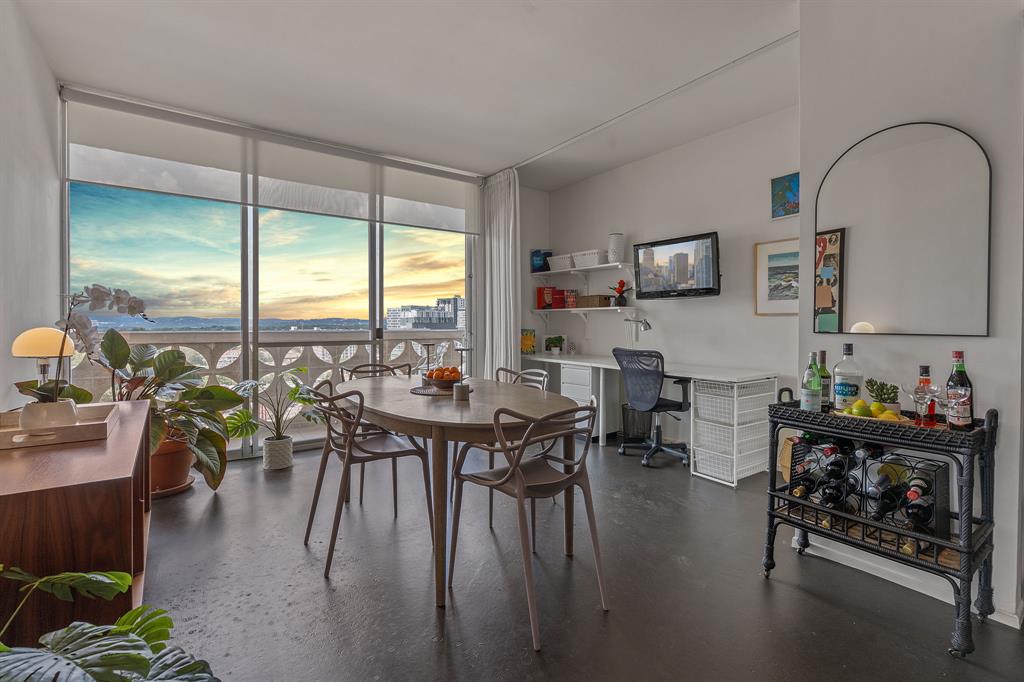 1801 Lavaca Street, Unit 12K Austin, TX 78701 - Photo 2 of 27 Dining area featuring floor to ceiling windows and built in desk