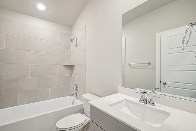 a bathroom with a sink toilet and bathtub