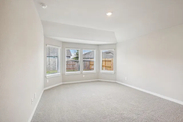 an empty room with a empty space and a window