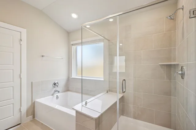 a bathroom with a bathtub and a sink