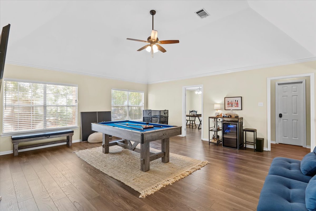 10116 Pinehurst Drive Austin, TX 78747 - Photo 15 of 37 Rec room with ornamental molding, vaulted ceiling, wood finished floors, ceiling fan, and pool table